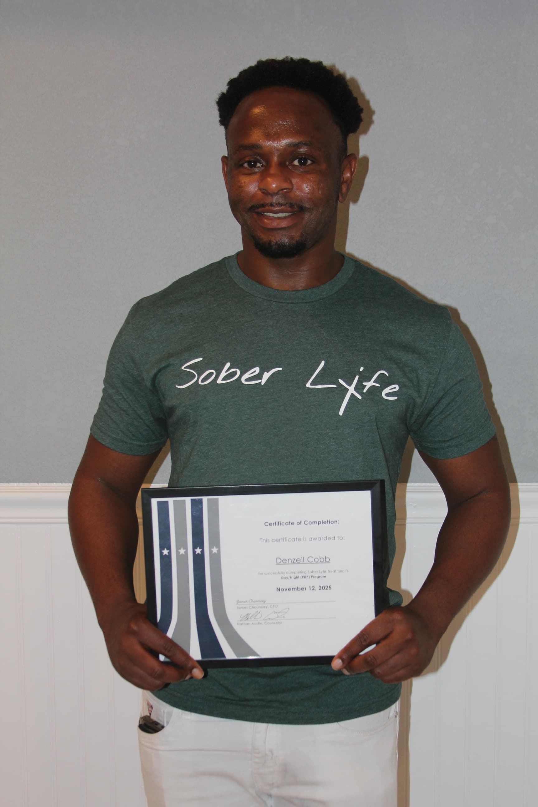 Denzell C. — Sober Lyfe Treatment graduate, holding a Certificate of Completion